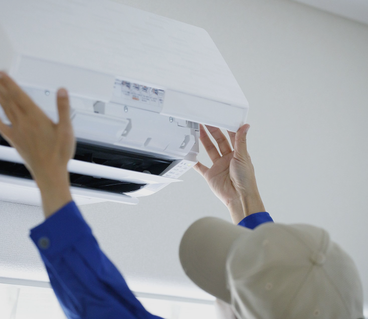 Cost U Less HVAC technician installing ductless mini split system